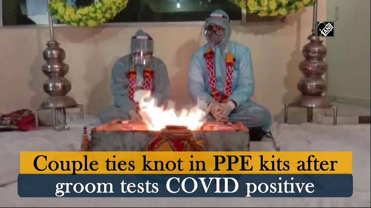Couple ties knot in PPE kits after groom tests Covid  positive