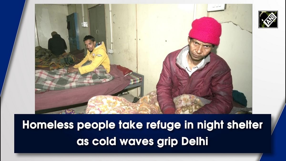 Homeless people take refuge in night shelter as cold wave grips Delhi