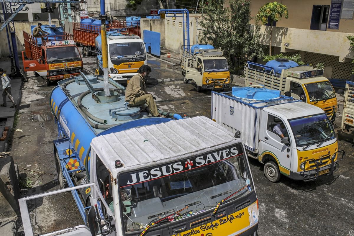 Water tank operators refill vehicles at a government-run station in Chennai on July 4, 2019, after all the city’s main reservoirs ran dry. Photographer: Dhiraj Singh/Bloomberg