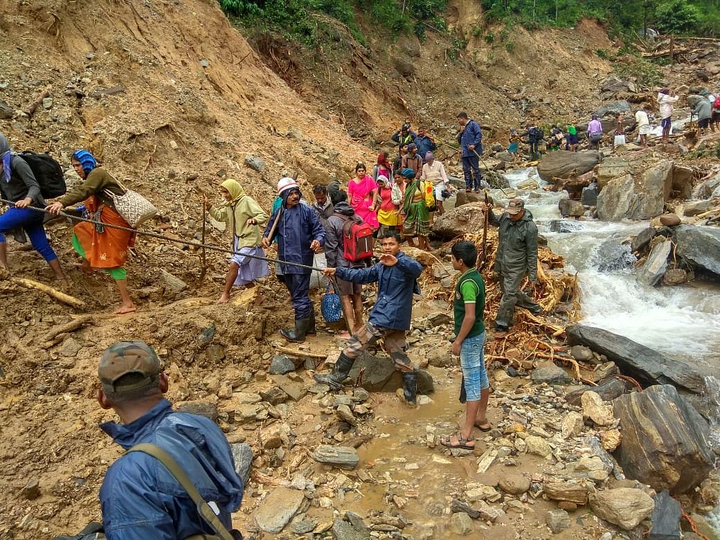 Troops from the Madras Engineers Group evacuate residents from Alehkhan,which was cut-off by a landslide in Chikkamagaluru District on 11 August 2019.