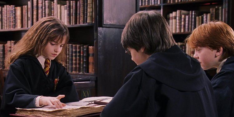 Hermione, Harry and Ron in the Hogwarts library