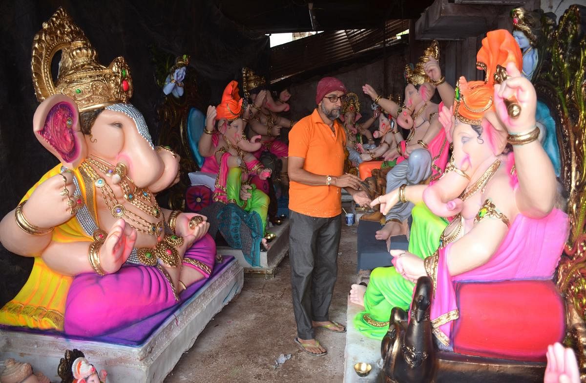 Vinayak Jyotiba Patil paints Ganesha idols at his workshop in Belagavi. (Pic special arrangement)