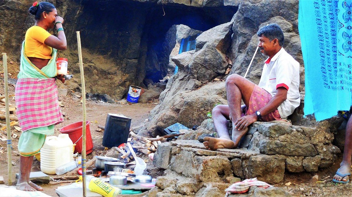 A Wadar wife sharing a light moment with her husband while cooking theirevening mail after a long day's work near Elephanta Caves.Photos by author