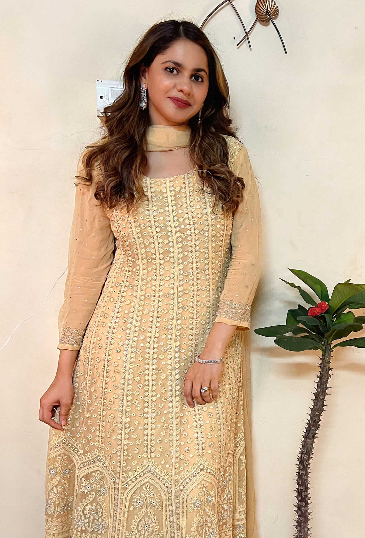 For this year's Eid style statement,Afreen has picked a summery yellowA-line dress embellished with cut dana