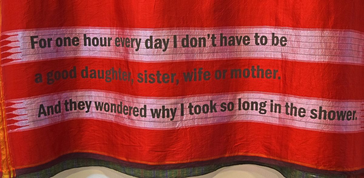 The artist worked with a local screen printer toget the text of the stories printed on the saris.