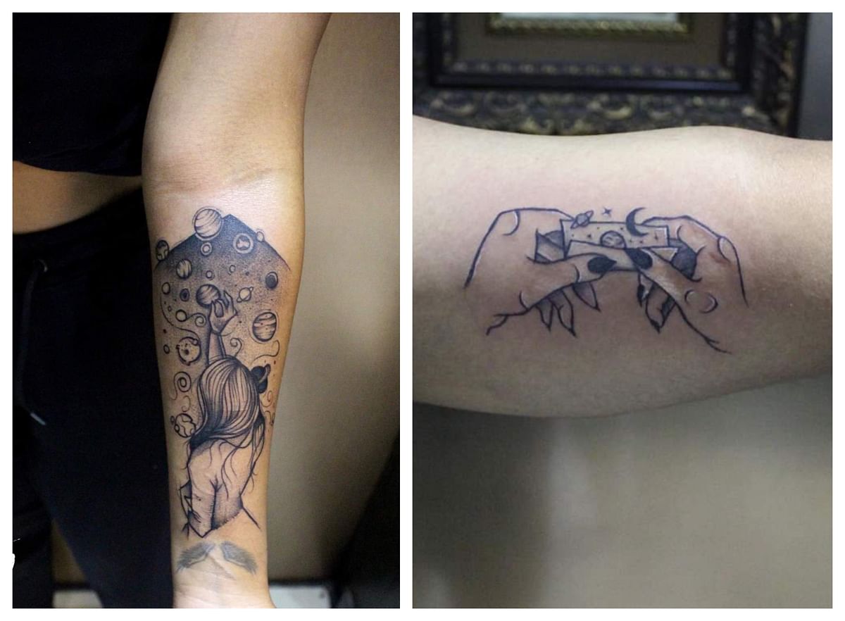 People are getting tattoos around the theme of freedom and breaking free, such as a woman reaching out to the galaxy or a universe folded into a piece of paper. Credit: Skin Deep