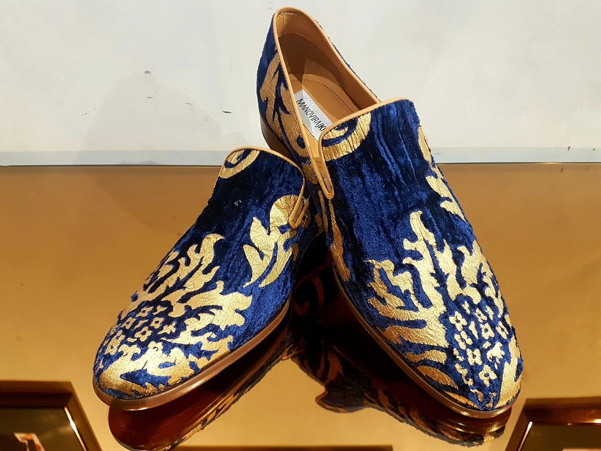 Blue crushed velvet shoes with gold screen print.