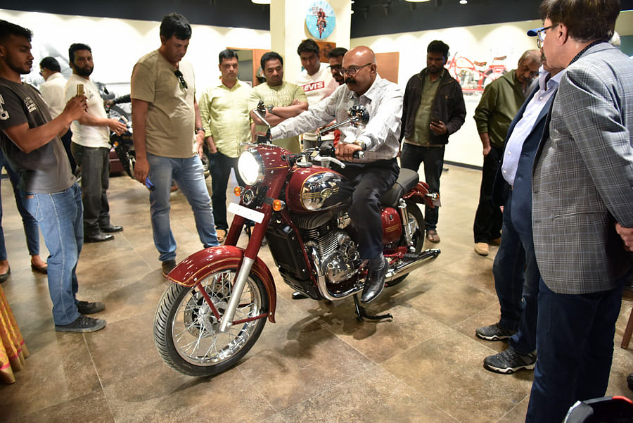 Visitors get a feel of the new Jawa bike. Janardhan BK/ DH Photo