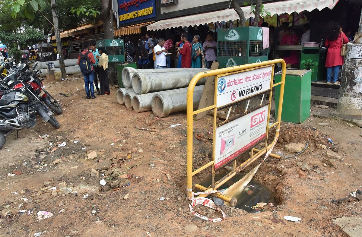 Shoppers in Jayanagar face hurdles at every step,thanks to dug-up, uneven and barricaded footpathsand huge pipes being dumped on the roads.