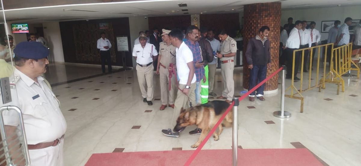 Police dog squad inspecting the site of the murder. Credit: Special Arrangement