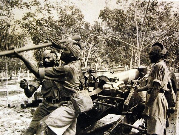 Indian gunners in training with field artillery in Singapore.
