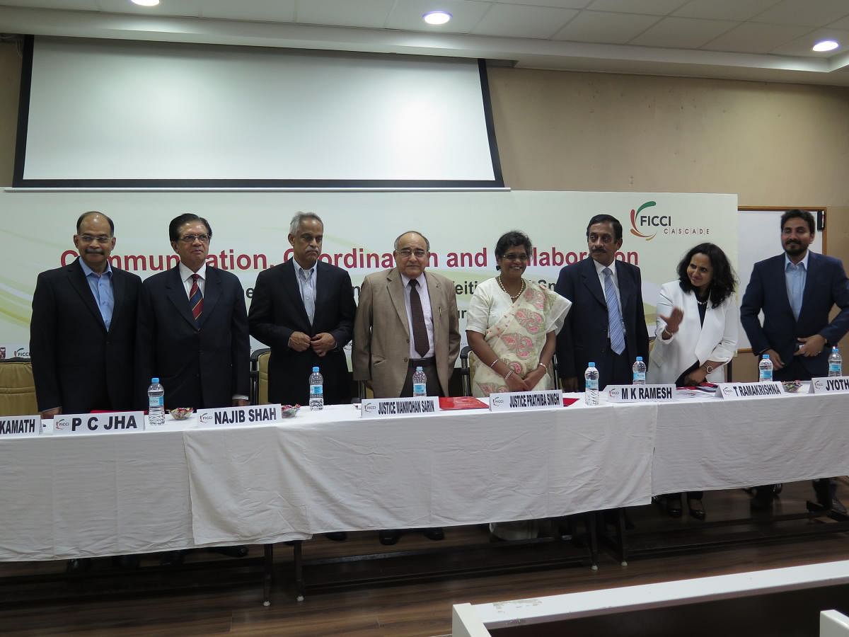 Members of the Judiciary and the police stand following a seminar on fighting counterfeit goods and smuggling at National Law School in Bengaluru on August 31, 2019.From left: FICCI Chairman Ullas Kamath, FICCI ex-Chairman P C Jha, ex-Chairman, Central Board of Indirect Taxes and Customs Najib Shah, Former Chief Justice Manmohan Sarin, Justice Prathiba Singh, NLS Professor T Ramakrishna, Aditya Birla Fashion VP (Legal) Jyothi V K and unknown NLS researcher.