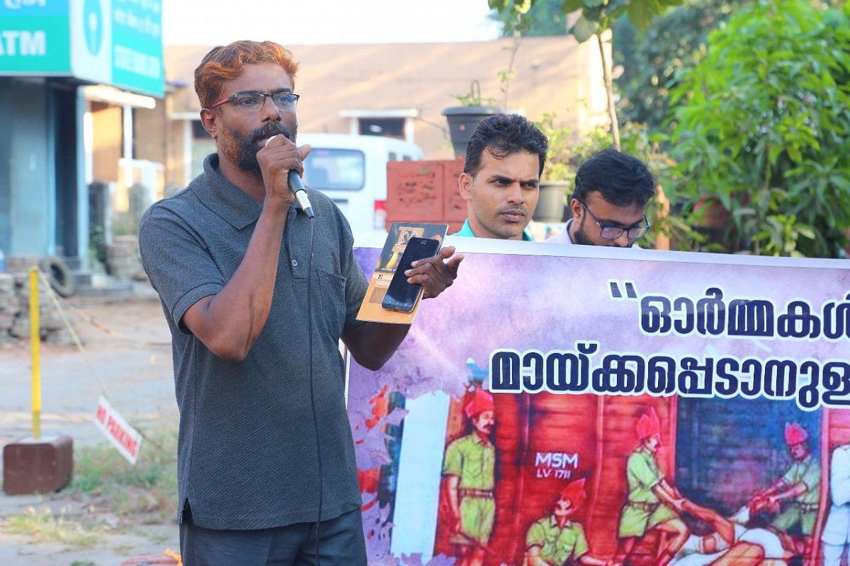 Kamalsy Najmal speaks during the protest against the removal of the mural in Tirur railway station, on Thursday (Image credit: Akmal Akku)