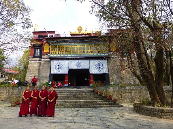 Monks posing for a photograph at Norbulingka Institute.