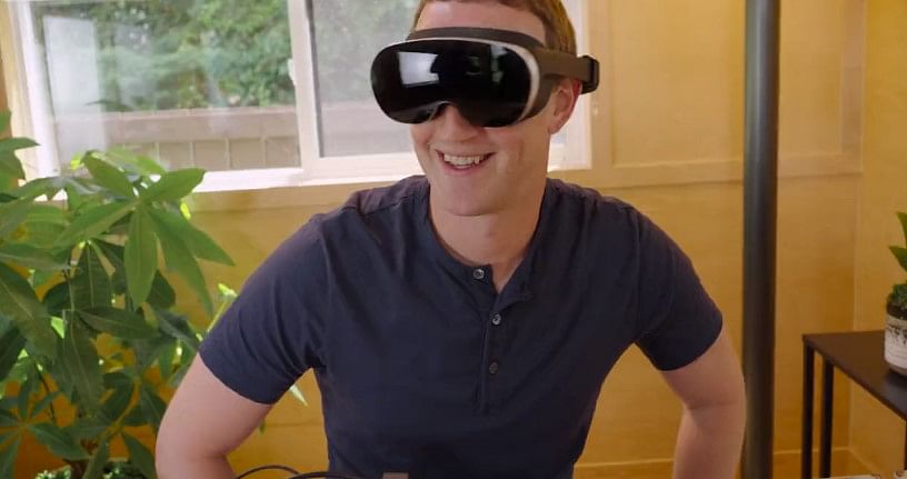 Meta co-founder Mark Zuckerberg showing off new VR headgear prototype Holocake 2 on Facebook (screen-grab)