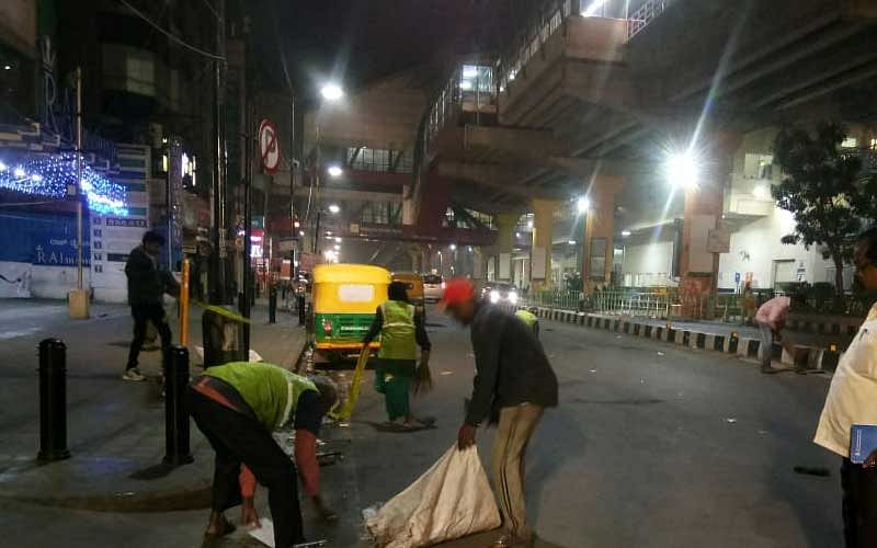 Pourakarmikas cleaning MG Road.