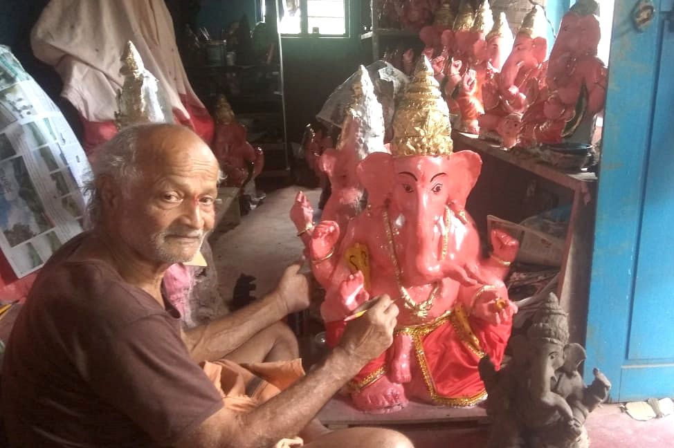 Panduranga Rao gives final touches to a clay idol of lord Ganesha. (Pic special arrangement)