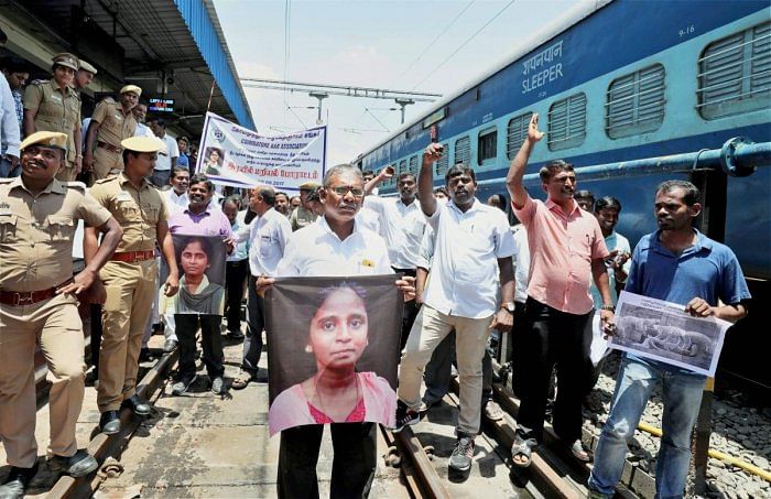 Protesters stop a train at Coimbatore railway stationas part of Rail Roko protest against NEET exam and justice for Anitha. Photo credit: PTI
