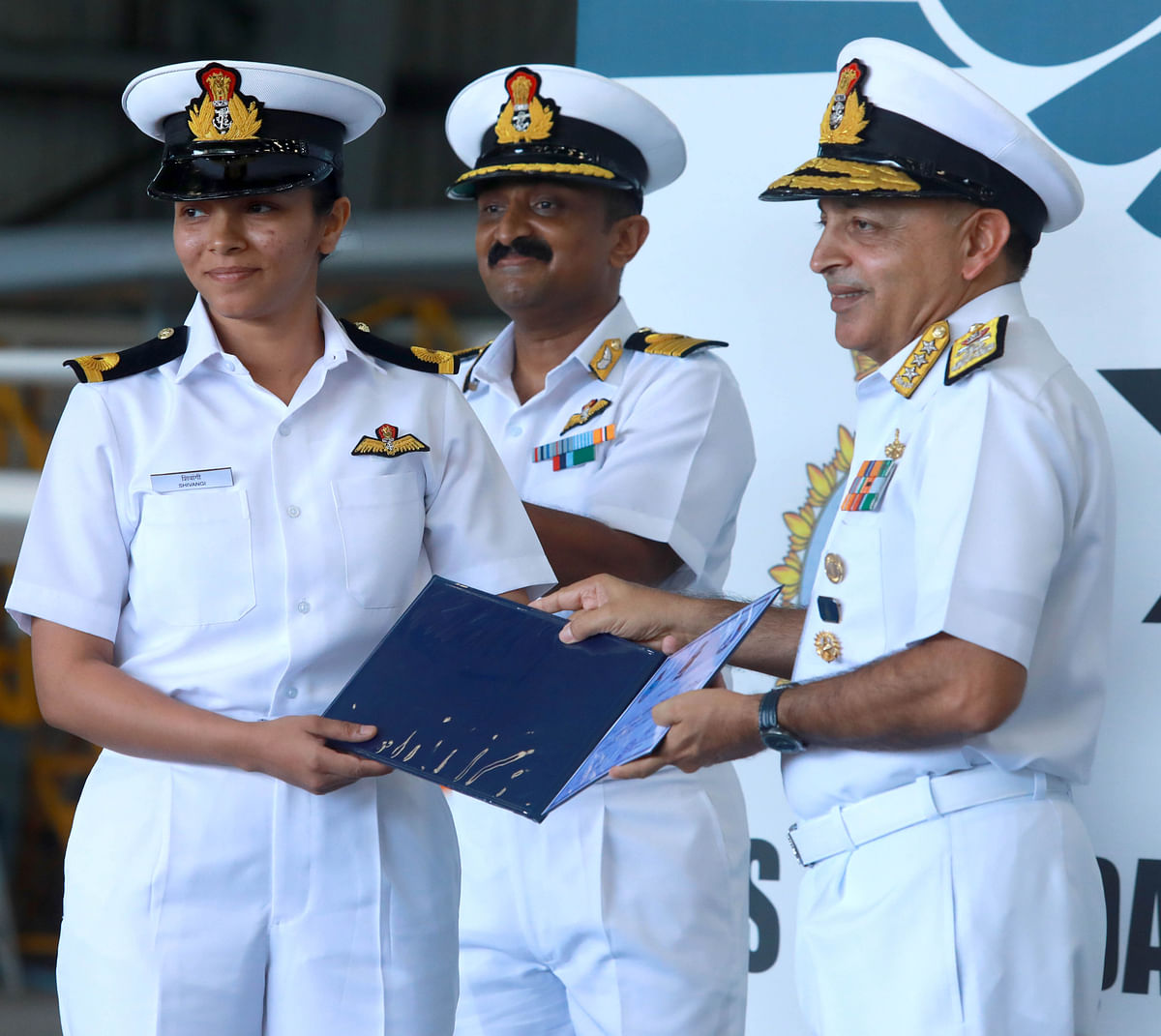 Vice Admiral A K Chawla awarding the wings to Navy's first woman pilot Shivangi at the awarding ofwings ceremony at the Southern Naval Command in Kochi on Monday.