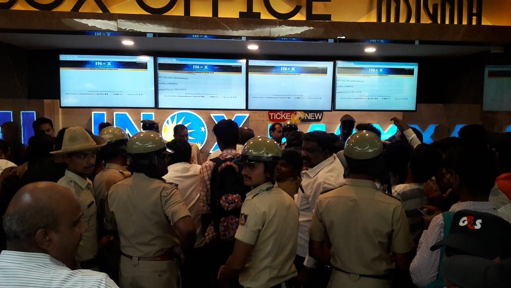 Large number of police personnel at the INOX ticket counters. (DH Photo by Sandesh M S)