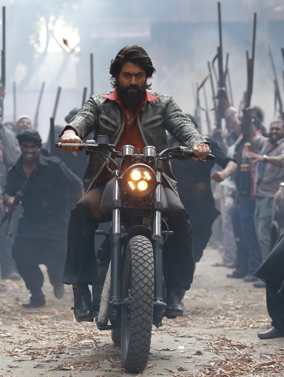 Yash rides a motorcycle fashioned after a vehicle seen on the roads inthat decade.