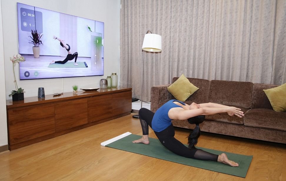 With YogiFi app, Samsung smart TV owners can subscribe to interactive virtual yoga sessions. Credit: Samsung India