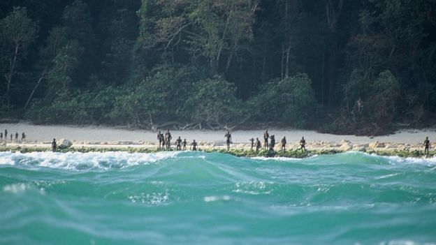 The Sentinelese stand guard on an island beach in 2005. Photo credit: CHRISTIAN CARON - CREATIVE COMMONS A-NC-SA