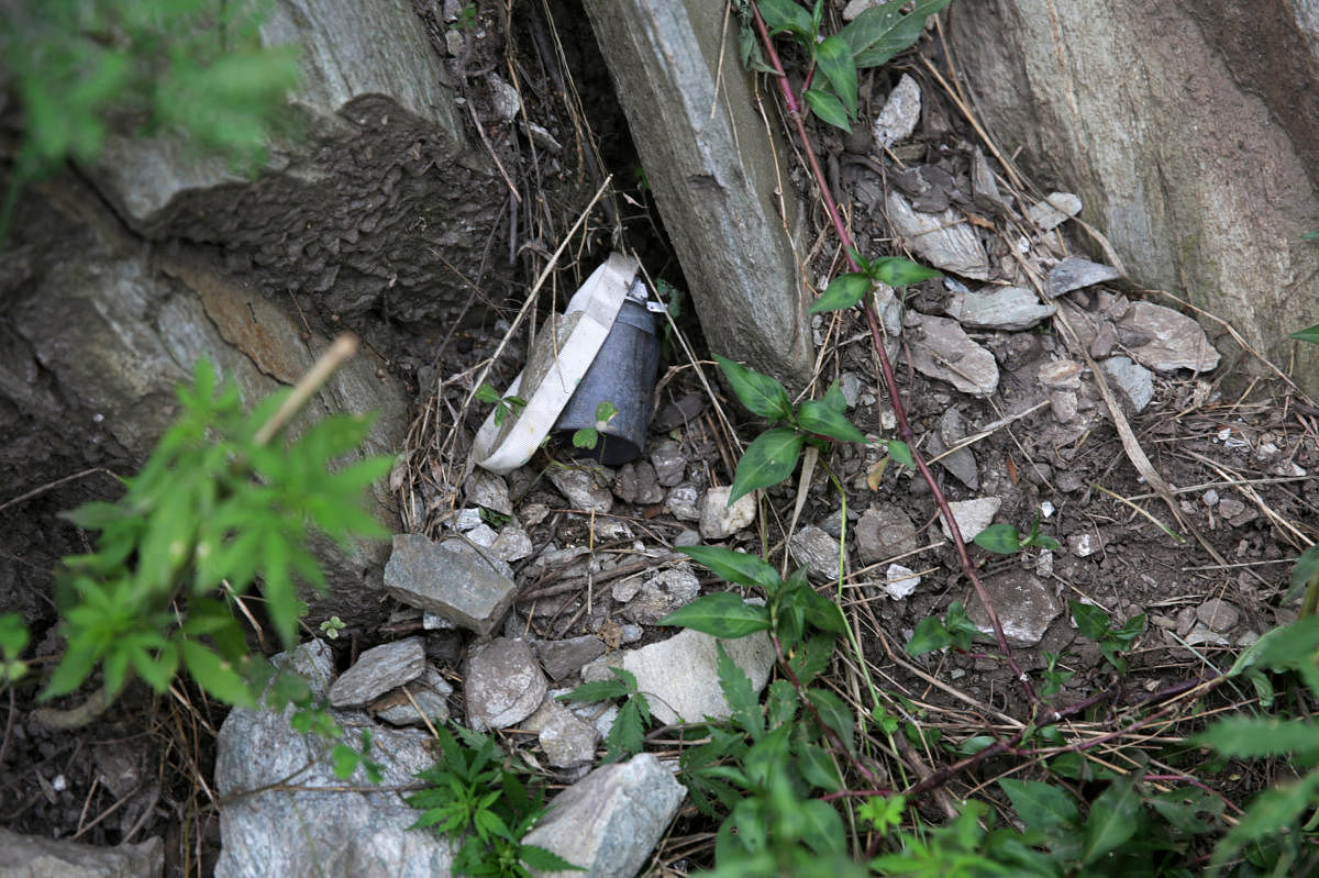 A device that the Pakistan military said is part of an unexploded cluster bomb is seen near the village of Jabri, in NeelumValley, in Pakistan-administrated Kashmir, August 9, 2019. Picture taken August 9, 2019. REUTERS/Saiyna Bashir