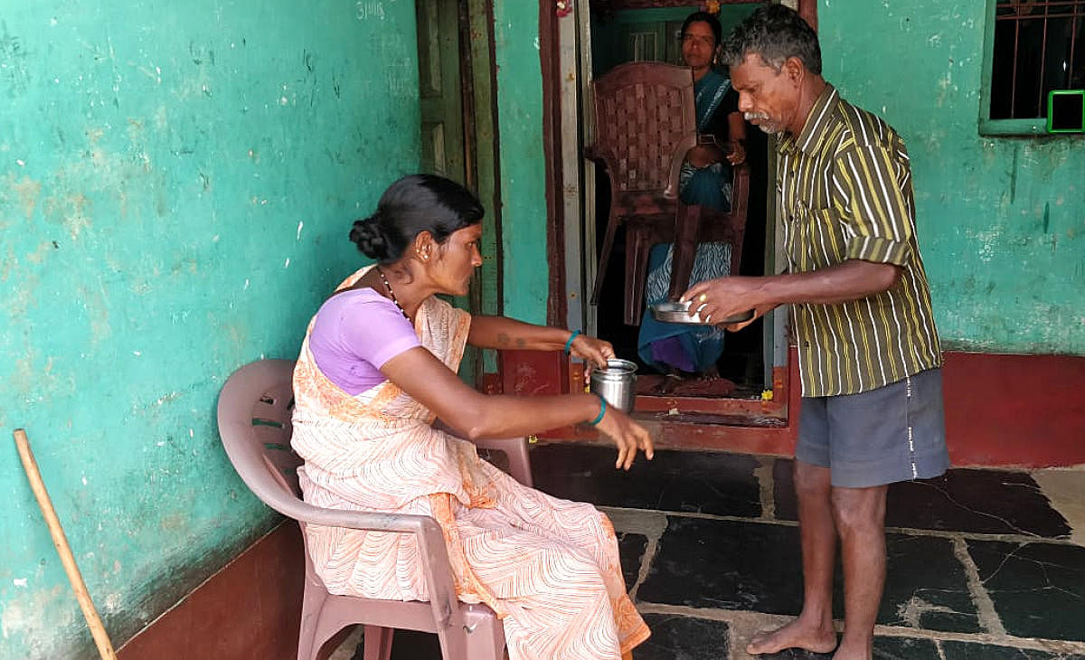 Geethanjali (left), who is affected by skeletal fluorosis, being tended to by her husbandat Kariyammanapalya of Pavagada taluk. DH photos /Ashwini Y S