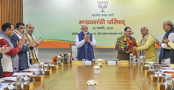 Haryana CM Manohar Lal Khattar (2R) greets newly elected BJP President JP Nadda (3R) as Prime Minister Narendra Modi (C) looks on, during a meeting of CM's, in New Delhi, Monday, Jan. 20, 2020. Union Ministers Amit Shah (3L), Rajnath Singh (R) and Nitin Gadkari (2L) are also seen. (PTI Photo)