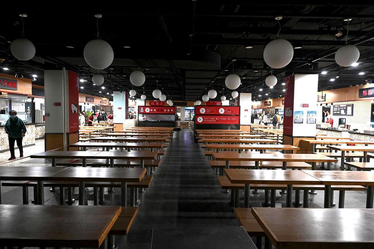 Empty seats are seen at an eatery after the government banned dining at restaurants to curb the spread of the Covid-19 coronavirus in Beijing on May 10, 2022. Credit: AFP Photo