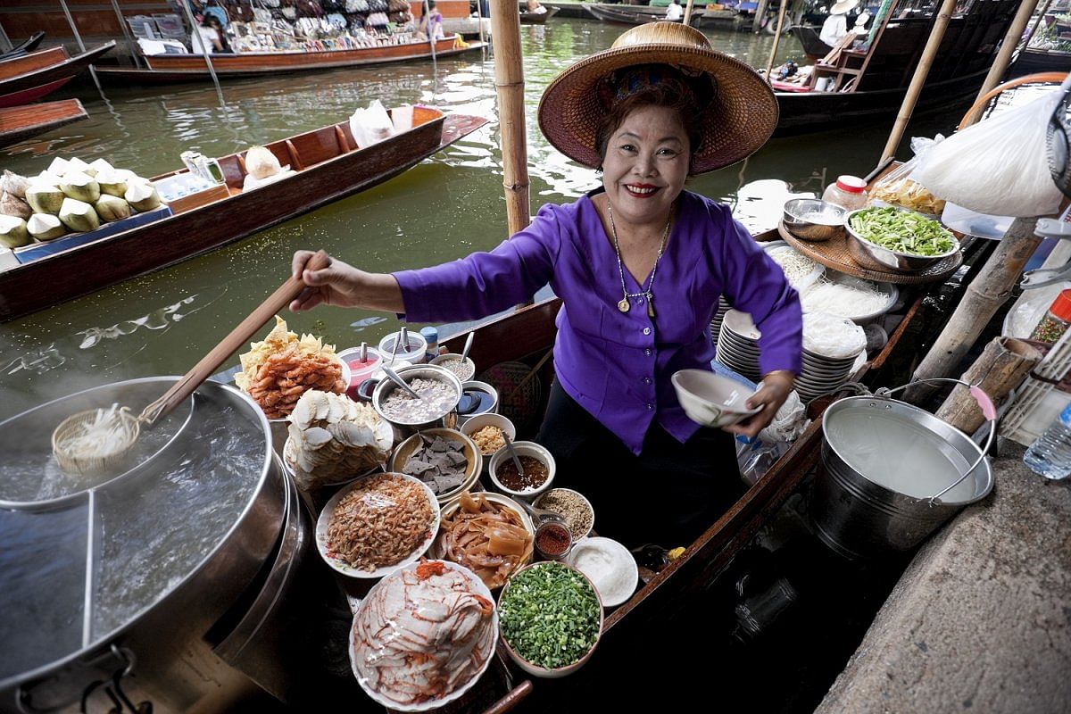 A food vendor at Damnoen Saduak Floating Market, Thailand