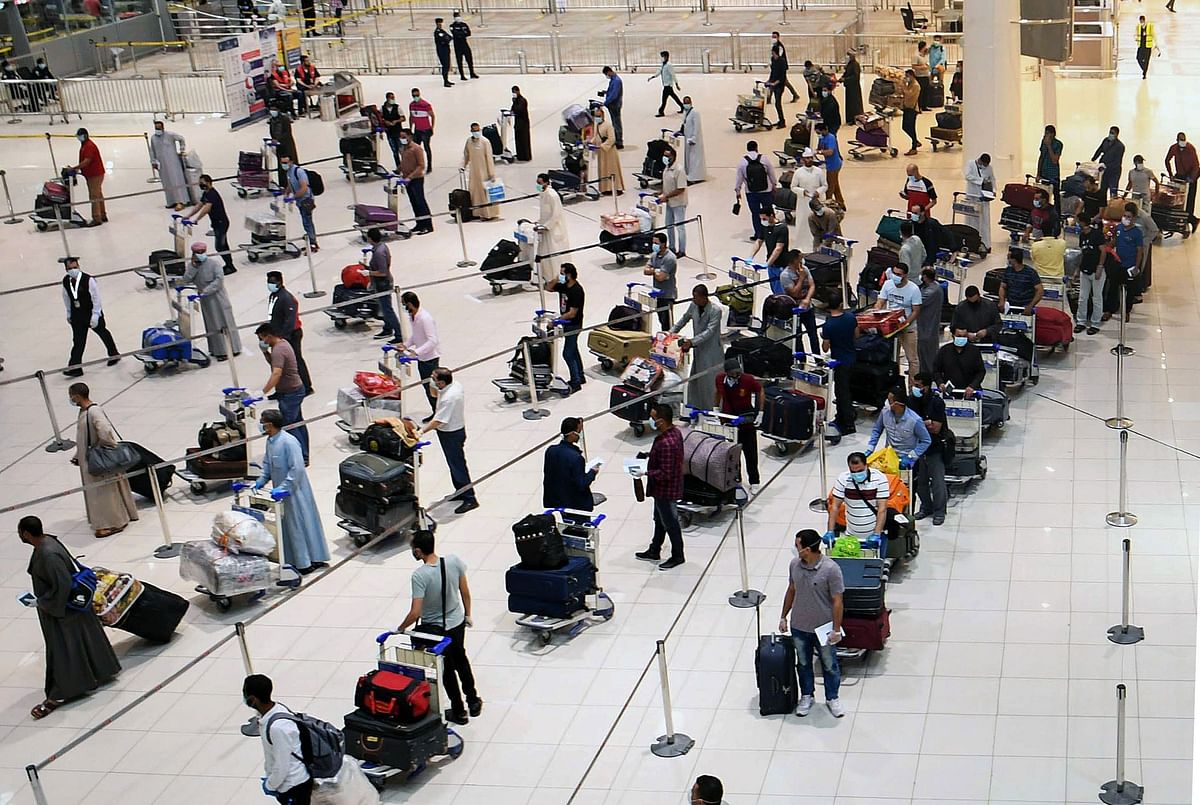 Kuwait vows to slash migrant population
