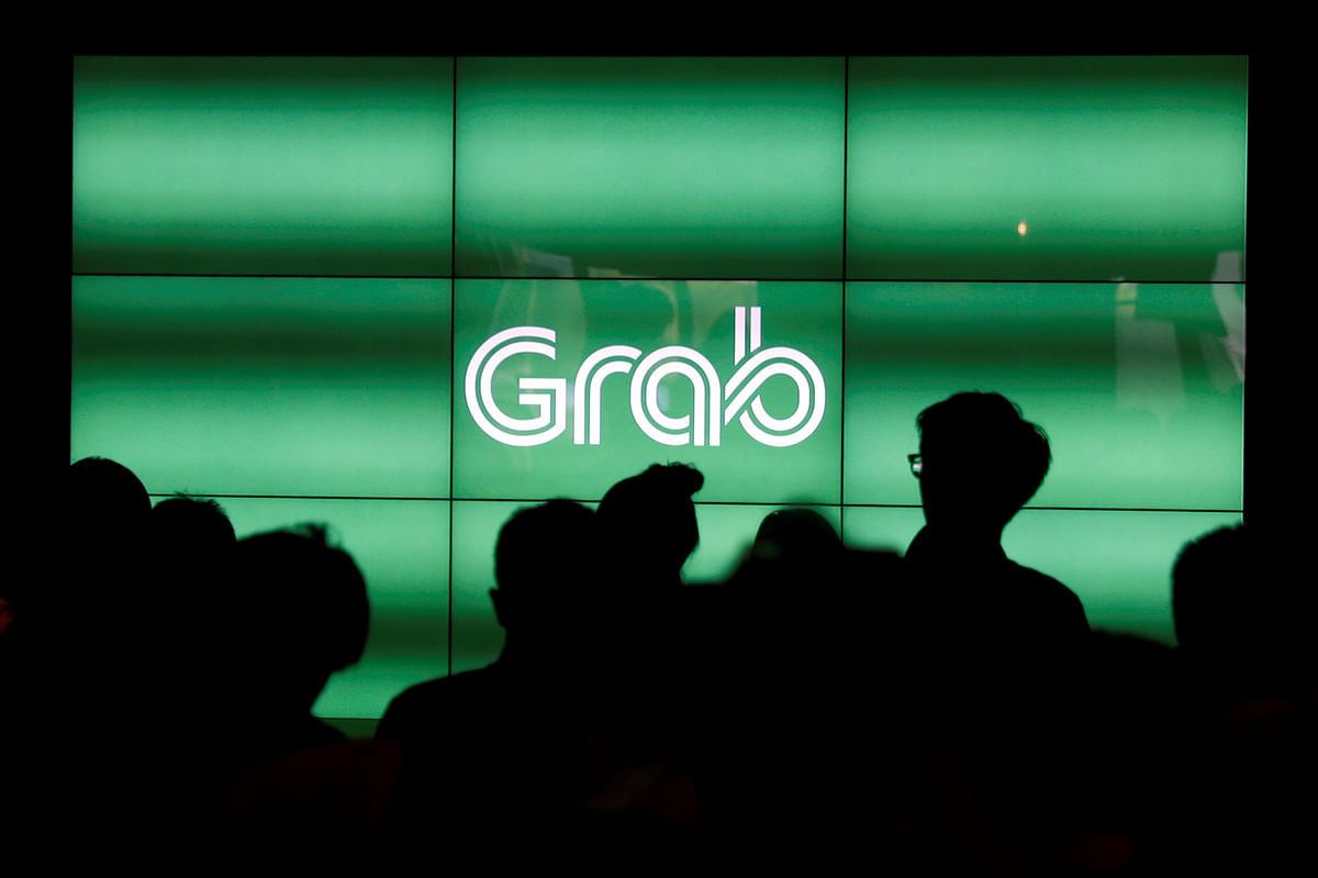 SoftBank-backed ride-hailing firm Grab set to announce layoffs: Report