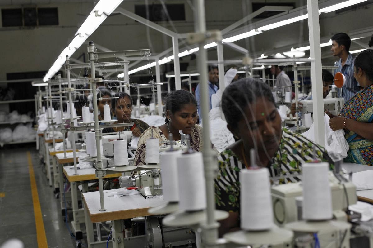 Employees sew clothes at the Estee garment factory in Tiruppur
