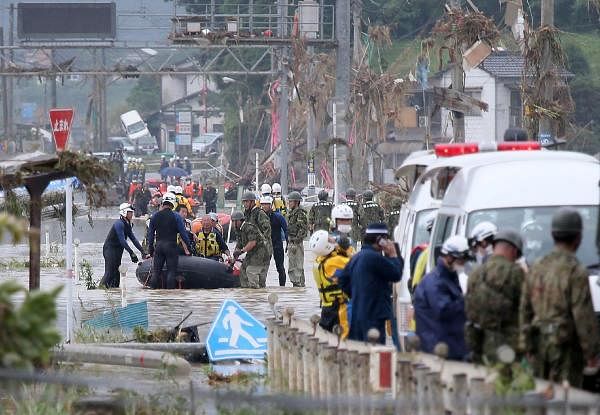 Floods sweep south Japan; 34 dead, many at nursing homes