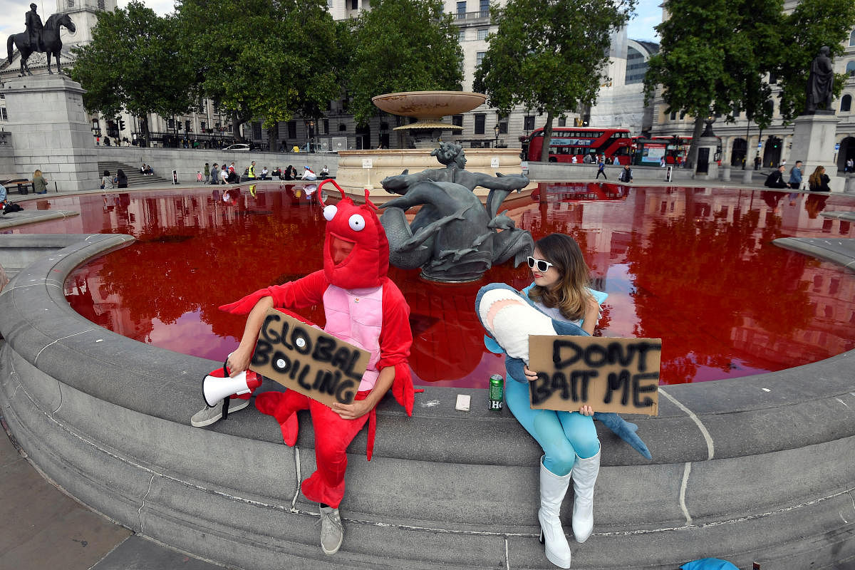 Animal rights protesters dye fountains red in London's Trafalgar Square