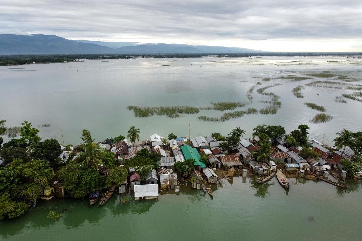 Monsoon rains pummel South Asia, displacing millions