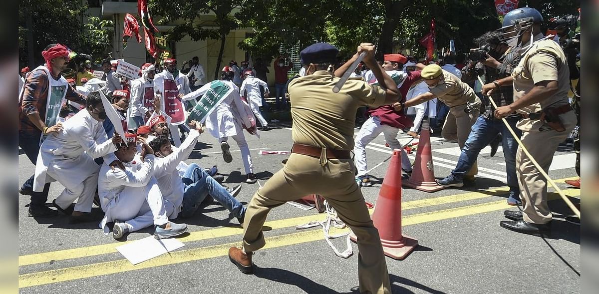SP student wing members lathicharged during protest against holding NEET, JEE Main