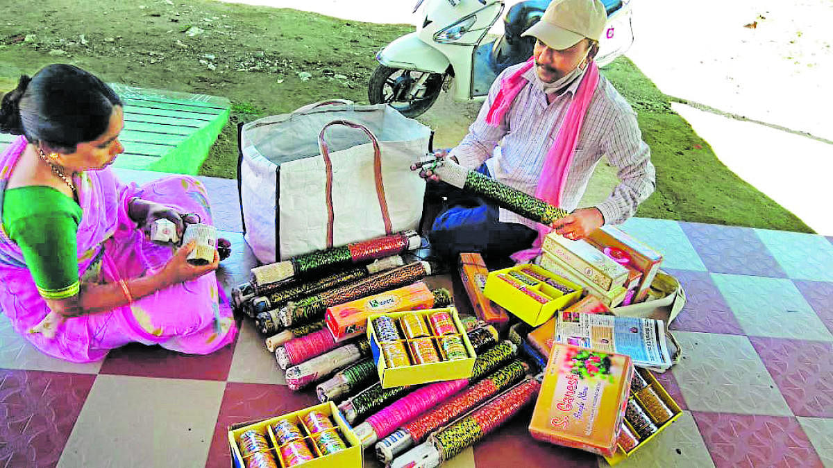 Doctorate holder spreads happiness by selling bangles