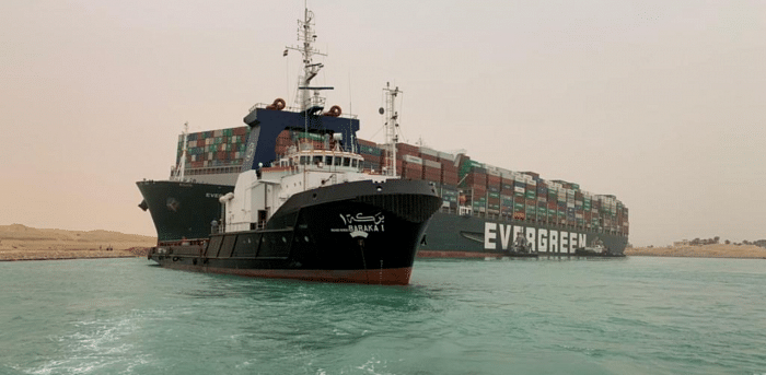Container ship runs aground in Suez Canal causing traffic jam