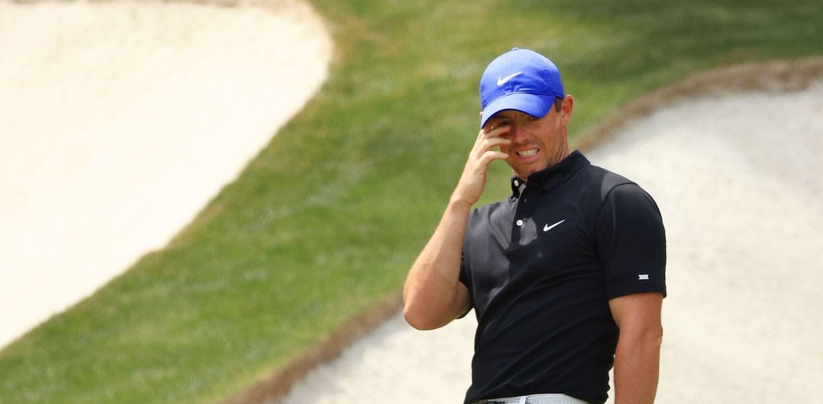 Fore, dad! Rory McIlroy sends errant Masters shot off his father