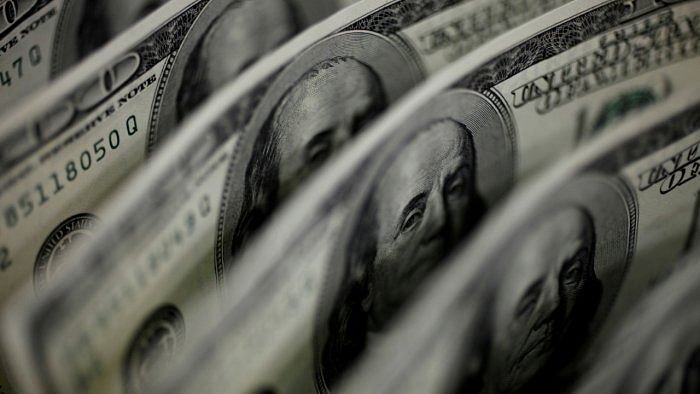 Dollar dips to four-week low as yields pull back; rouble sinks