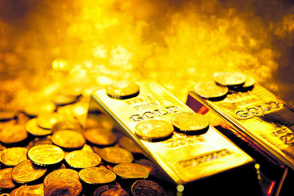 Gold subdued on firmer dollar; focus on US jobs report