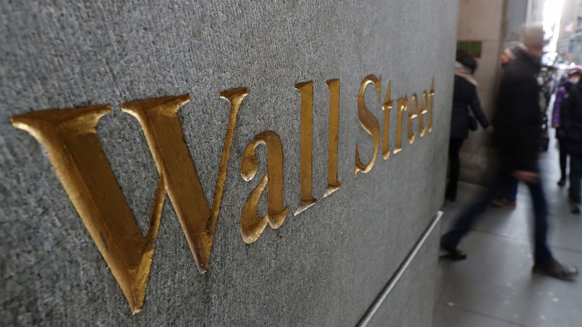 Wall Street: Dow falls back after topping 35,000 for 1st time, Nasdaq sinks