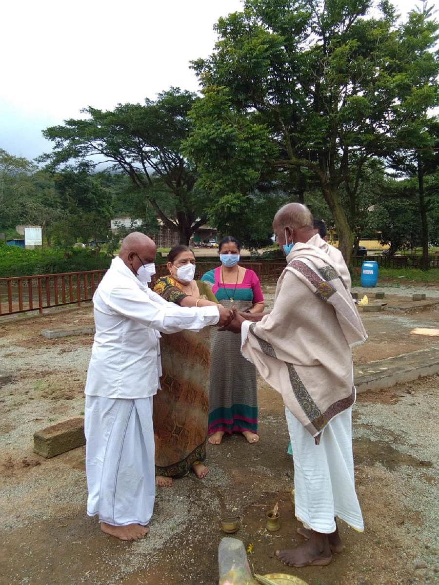People perform rituals at Triveni Sangama