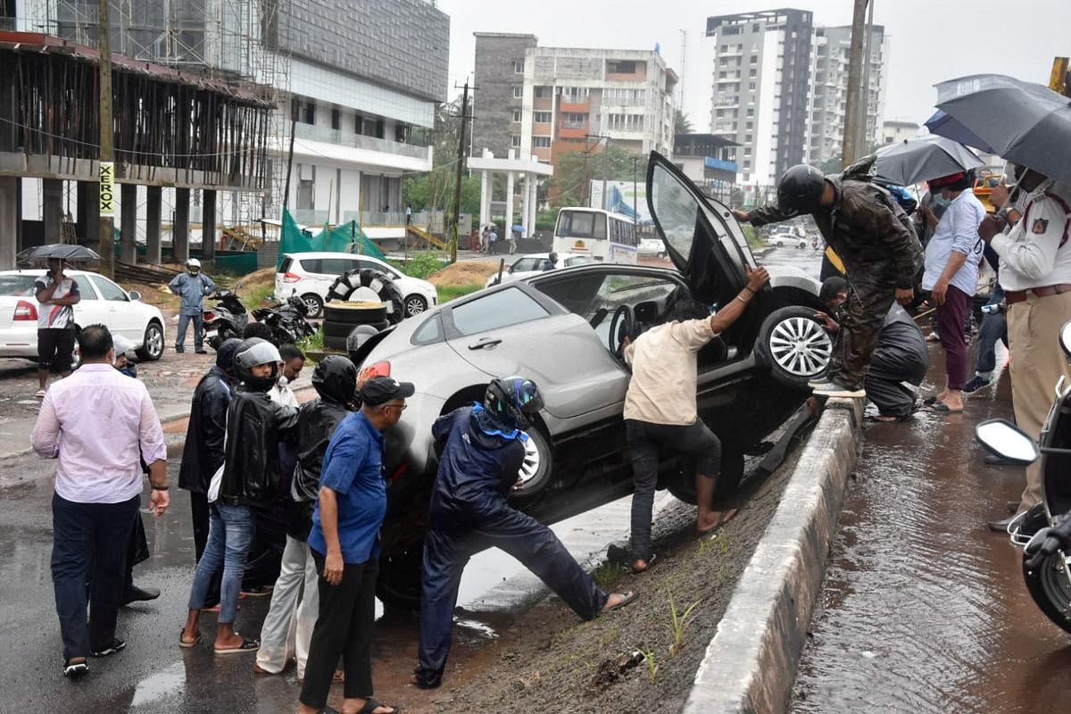 Car slips from flyover, falls on service road