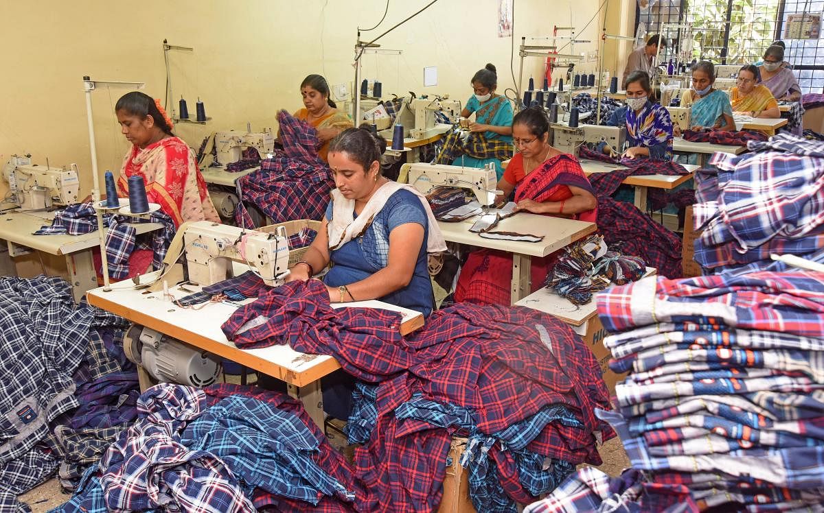 Garment workers back at work, many unvaccinated