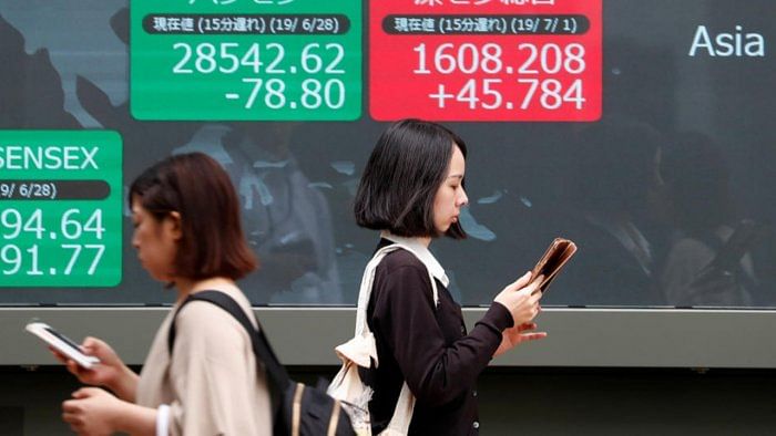 Asian markets track Wall St record as Powell soothes taper fears