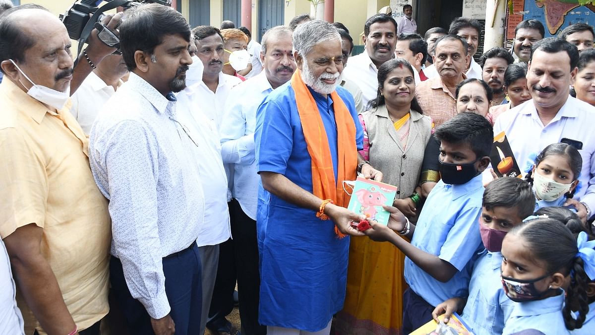 Education Minister B C Nagesh greets students with roses
